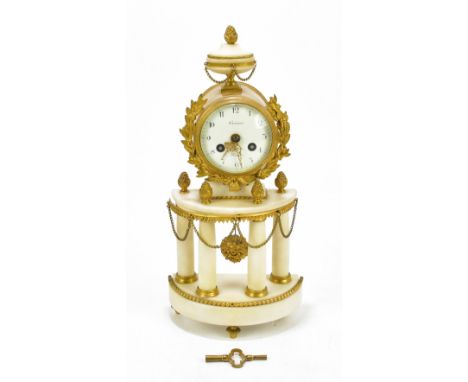 A 19th century French gilt metal and white marble eight day mantel clock, the enamel dial with Arabic numerals, indistinctly 