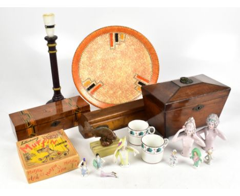 An early 19th century mahogany sarcophagus shaped tea caddy, with an inlaid glove box, a wooden weight, eight pin head dolls,