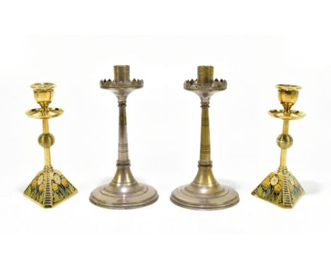 A pair of cast brass and enamel candlesticks, with floral detail, height 16.5cm, and another pair (4).