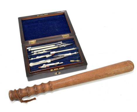 A set of Victorian rosewood cased draughtsman's drawing instruments and a mid 20th century truncheon, length 40cm (2).Additio