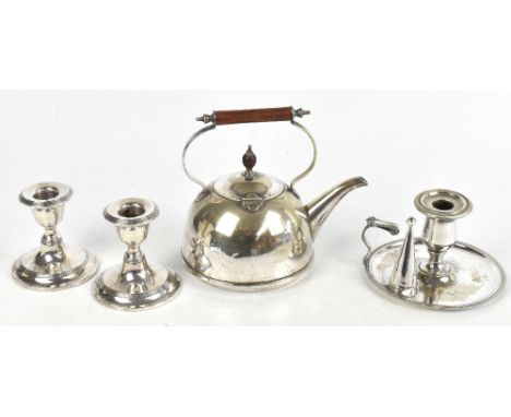 A pair of hallmarked silver dwarf candlesticks, Birmingham 1917, height 9cm, with a plated chamber stick and a plated kettle 