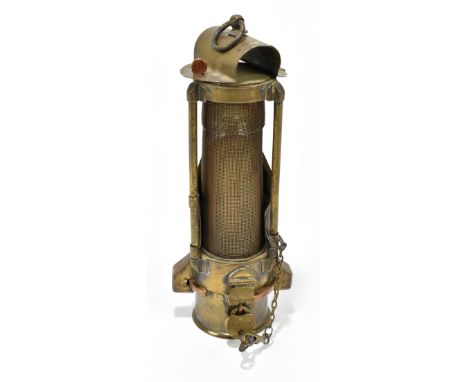A rare and unusual miners brass Davy lamp with lock and key, height 20cm.&nbsp;