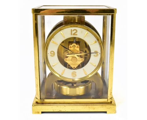 JAEGER LECOULTRE; an Atmos mantel time piece, with Roman numeral and baton dial, movement numbered 131445 and lacquered brass