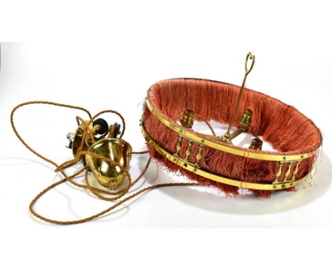 A late 19th century decorative gilt brass Arts & Crafts style rise and fall light fitting of circular form pierced decoration