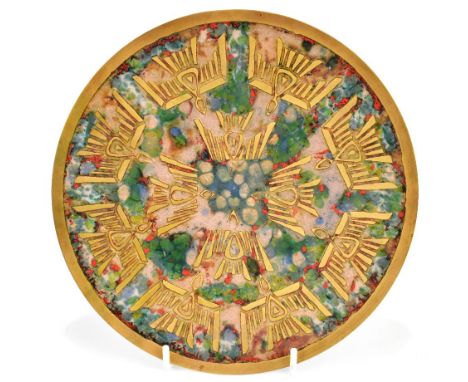 A mid 20th century German brass and enamel decorated shallow dish of Aztec design, diameter 21.5cm.