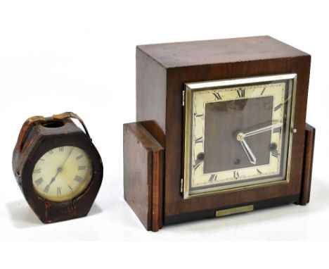 A British made Art Deco walnut cased mantel clock with applied silver chapter dial bearing Roman numerals, height 23cm, width