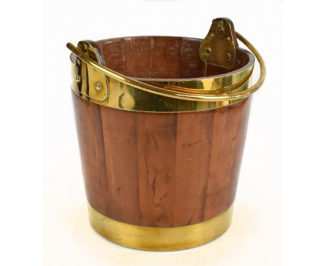A brass bound coopered pine log bucket with swing handle, height 34cm.Additional InformationLight age wear but essentially OK