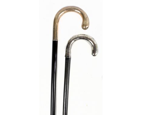 An early 29th century silver mounted and ebonised walking stick, with a Continental 800 standard silver mounted walking stick