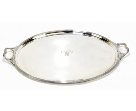 A large silver plated twin handled serving tray, with reeded border and central engraved initial 'M', retailed by Finnigans, 
