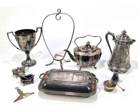 A 19th century hallmarked silver button polisher, London 1804, width 10.5cm, with a Victorian Britannia metal drinks ewer, an