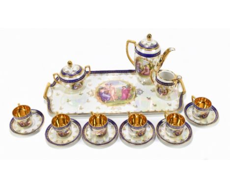 A decorative Czechoslovakian coffee service comprising gilt heightened tray, coffee pot, jug, sucrier and cover and six coffe
