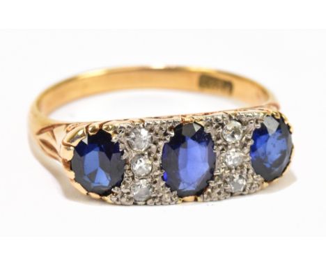 An 18ct yellow gold diamond and sapphire ring, set with three oval sapphires and six diamonds, gross weight 4g.Additional Inf