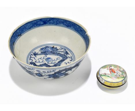 A 19th century Chinese blue and white porcelain footed bowl painted with four claw dragons chasing the pearl of wisdom, bears