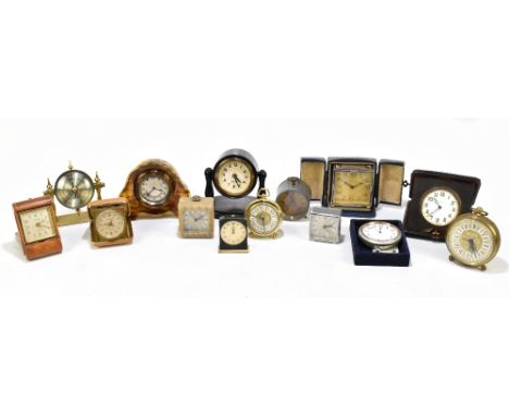 A group of timepieces and alarm clocks including a Kienzle base metal and enamel decorated paste example, a small cased examp