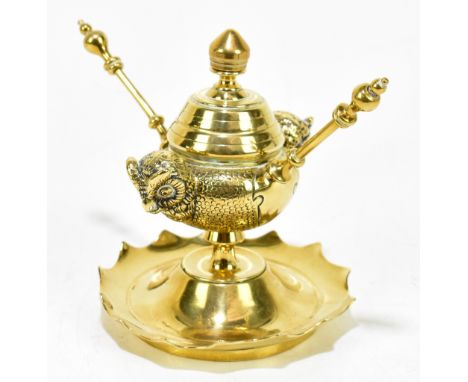 A novelty brass table lighter modelled with two owl heads, height 10cm.