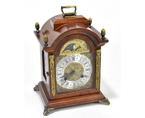 A modern walnut eight day mantel type clock, with Roman numeral chapter ring below moon phase, with movement striking on a be