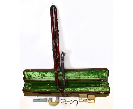 OSCAR ADLER; a contra bassoon, 175cm, cased.Additional InformationTarnishing and minor dent to the metalwork, heavy scratches