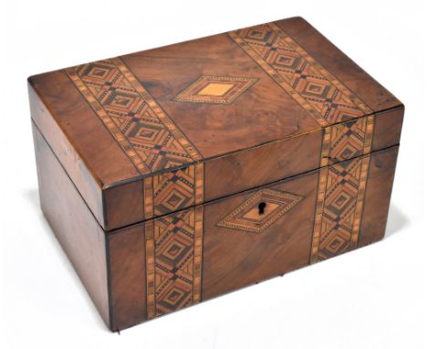 A Victorian parquetry inlaid walnut tea caddy of rectangular form, the hinged cover enclosing two compartments, width 24cm.