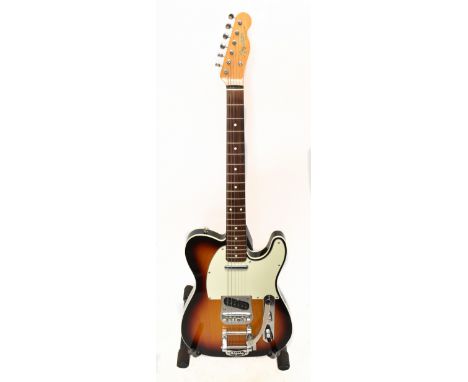 FENDER; a Japanese Telecaster fitted with a Bigsby lebratto, serial no.Q073481, with a hard case.Additional InformationMinor 