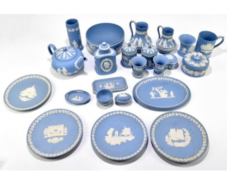 WEDGWOOD; a collection of blue jasparware including a pair of lidded cylindrical pots, tea caddy and cover, various collector