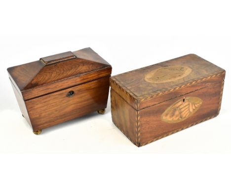 An early 19th century inlaid mahogany tea caddy of rectangular form with inlaid panels decorated with shells in a decorative 