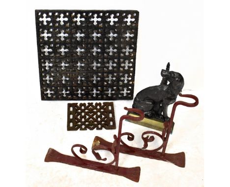 A vintage cast iron drain grill, 46 x 46cm, with a pair of wrought iron wall brackets, a cast iron fire dog and a further cas