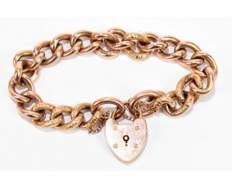 A 9ct rose gold part textured curb link bracelet with padlock clasp, approx 22.9g.Additional InformationLight wear to the tex