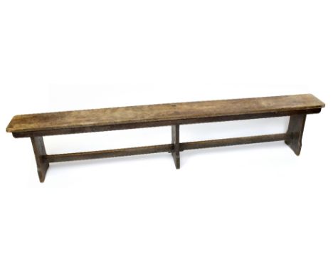 An early 20th century long oak bench, height 47cm, length 244cm