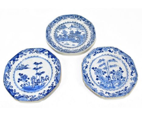 Three 18th century Chinese Export blue and white plates of octagonal form, each decorated with various landscape scenes, diam