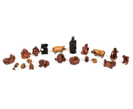 A collection of twenty-one modern Chinese and Japanese carved wood okimono, netsuke and models, the tallest 7.5cm.