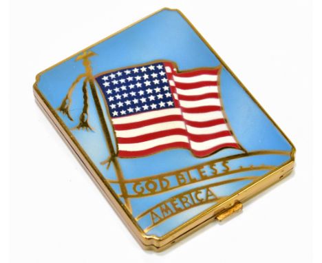 AMERICAN INTEREST; a vintage brass and enamel decorated compact inscribed 'God Bless America' beneath the American flag, 7.5 