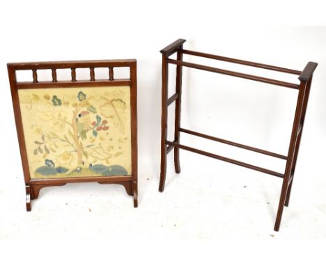 An early 20th century mahogany framed firescreen with tapestry inset panel, height 80cm, and an Edwardian towel rail (2).