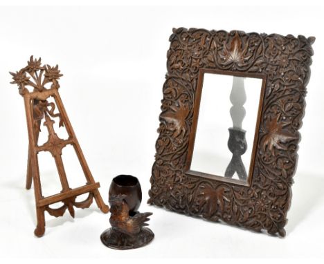 BLACK FOREST; a late 19th century carved wood spill vase modelled as a chicken and an egg, height 8.5cm, with an Anglo-Indian