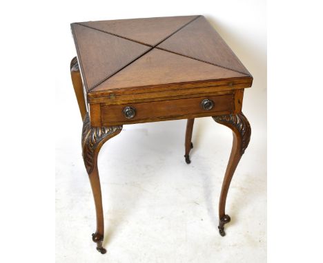 An Edwardian oak envelope card table, with baize material to the interior, raised on carved cabriole supports, height 75cm, w