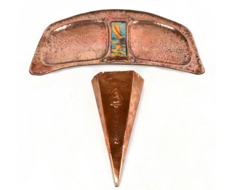 An Arts &amp; Crafts copper dish of arched form with central enamelled panel, width 41cm, height 20cm, and a copper wall pock