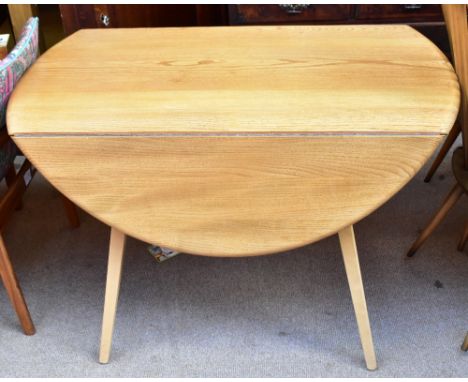 ERCOL; a light elm drop-leaf dining table, width 107cm.