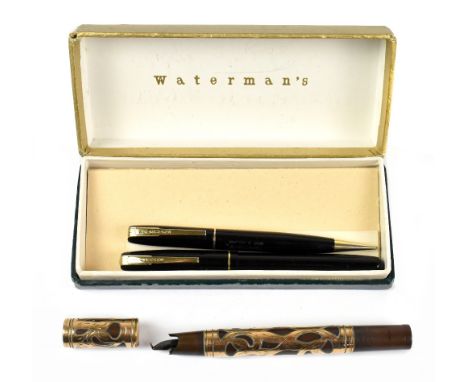 WATERMAN'S; a boxed black body fountain pen with matching ballpoint pen and a yellow metal clad fountain pen, badly af, (3).A