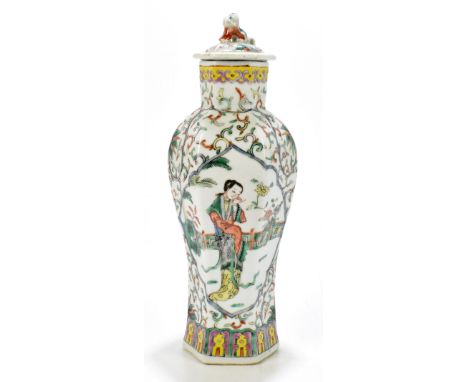 A late 19th century Chinese porcelain Famile Verte hexagonal vase and cover, decorated with maidens in a landscape setting wi