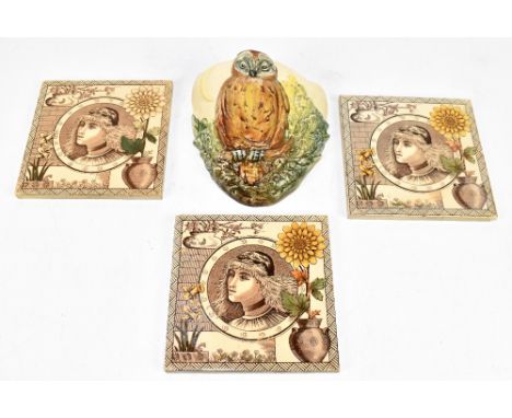 ROYAL DOULTON; a wall pocket moulded with an owl and crescent moon, length 19cm, with three Aesthetic ceramic tiles (4).Addit
