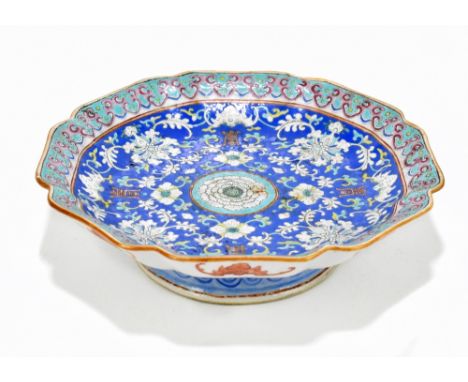 A 19th century Chinese porcelain footed bowl of octagonal form, decorated with stylised floral detail and bats to the centre 