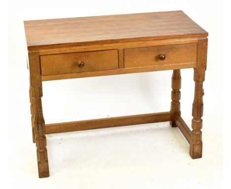 WORKSHOP OF ROBERT MOUSEMAN THOMPSON; an oak side table with adzed top, with two frieze drawers above octagonal columns and b