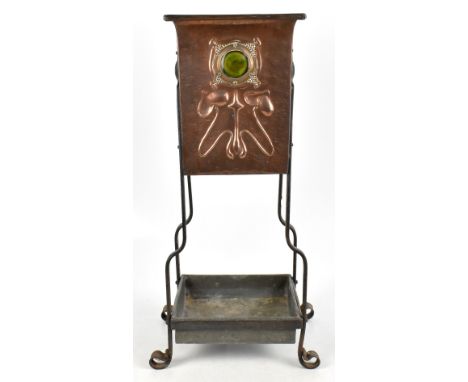An Arts &amp; Crafts stick stand, the upper section copper body with Ruskin style cabochons and embossed detail on an iron fr