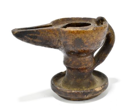 An earthenware Roman style oil lamp, height 10cm.
