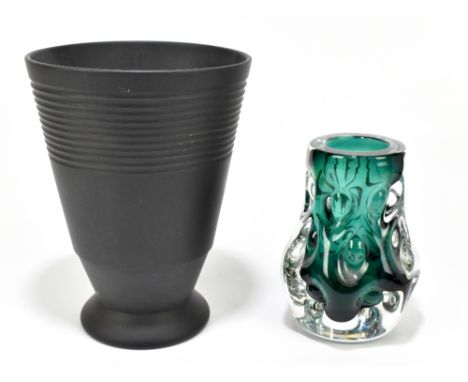 KEITH MURRAY FOR WEDGWOOD; a ribbed tapering Black Basalt vase, impressed and printed marks, height 20cm, and a Liskeard gree