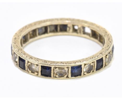 A white metal diamond and sapphire full eternity ring, size L, approx 2.7g (two stones missing).Additional InformationWear an