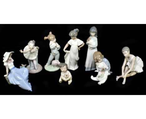 NAO; a collection of eight figures including a seated ballerina, height 14cm (8).Additional InformationThe ballerina with her