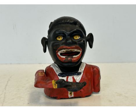 Cast iron money bank Notice from the the-saleroom.com: These items are listed on the basis they are illustrative of a bygone 