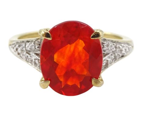 9ct gold single stone fire opal ring, with diamond shoulders and gallery, hallmarked Condition Report:Approx 3.15gm, size N-O