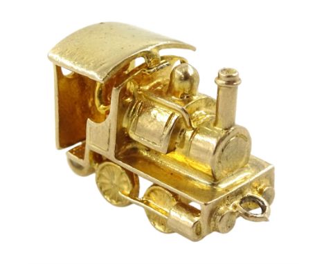 9ct gold steam engine pendant/charm, with hinged cab, hallmarkedCondition Report:Approx 4.65gm, length = 17mm
