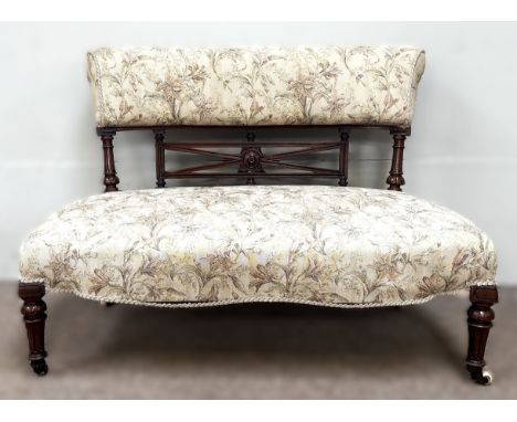 A c. 1900 small sofa with sprung seat on tapering supports terminating in castors, 72 x 105 x 55 cm.